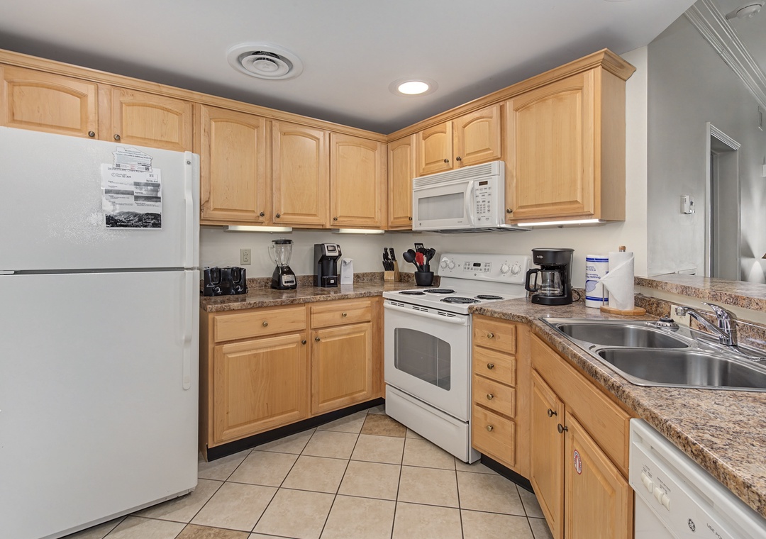 Your fully equipped kitchen awaits with granite counters, modern appliances, and everything needed for home-cooked meals during your stay.
