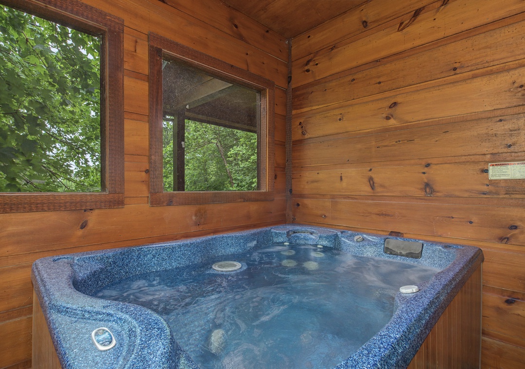 Slip into your private hot tub and let the warm, bubbling water melt away stress while you gaze at lush forest views through surrounding windows.