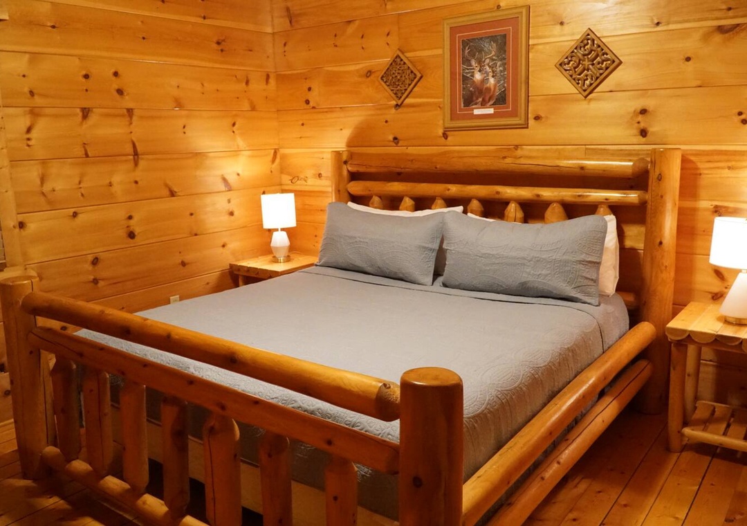 Drift into peaceful sleep in this cozy log cabin bedroom, where rustic charm meets comfort with soft linens and warm wood.