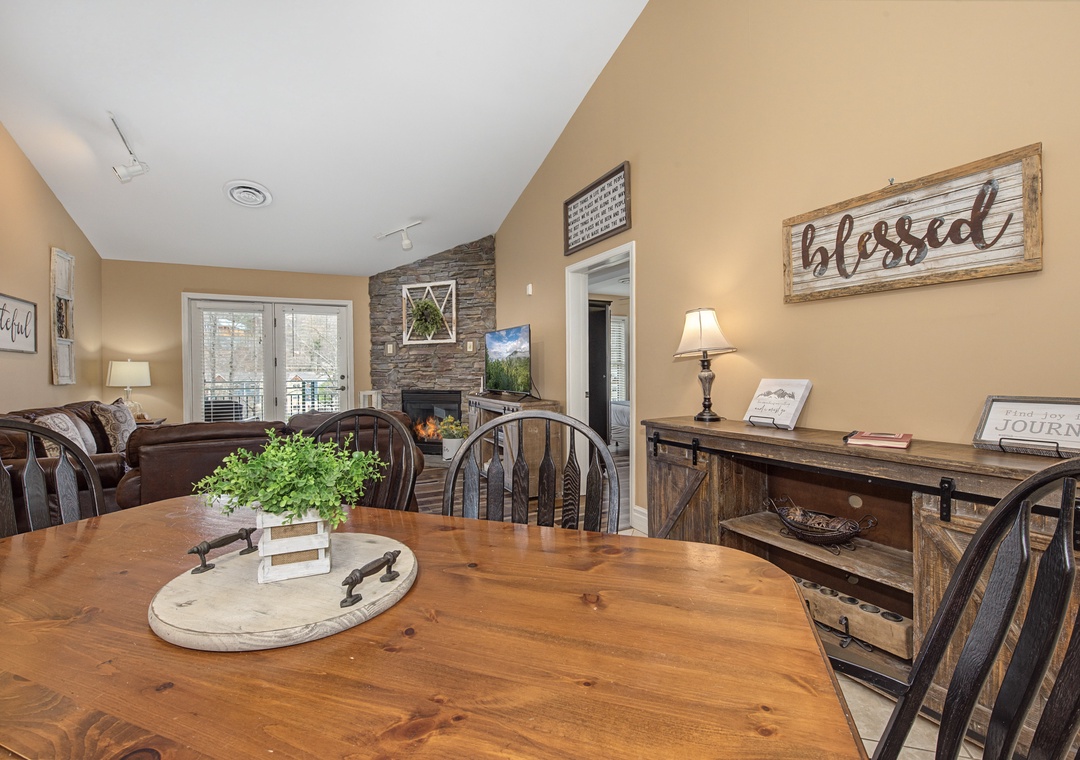 Gather around your rustic wooden dining table, where home-cooked meals taste even better with the cozy fireplace crackling nearby.