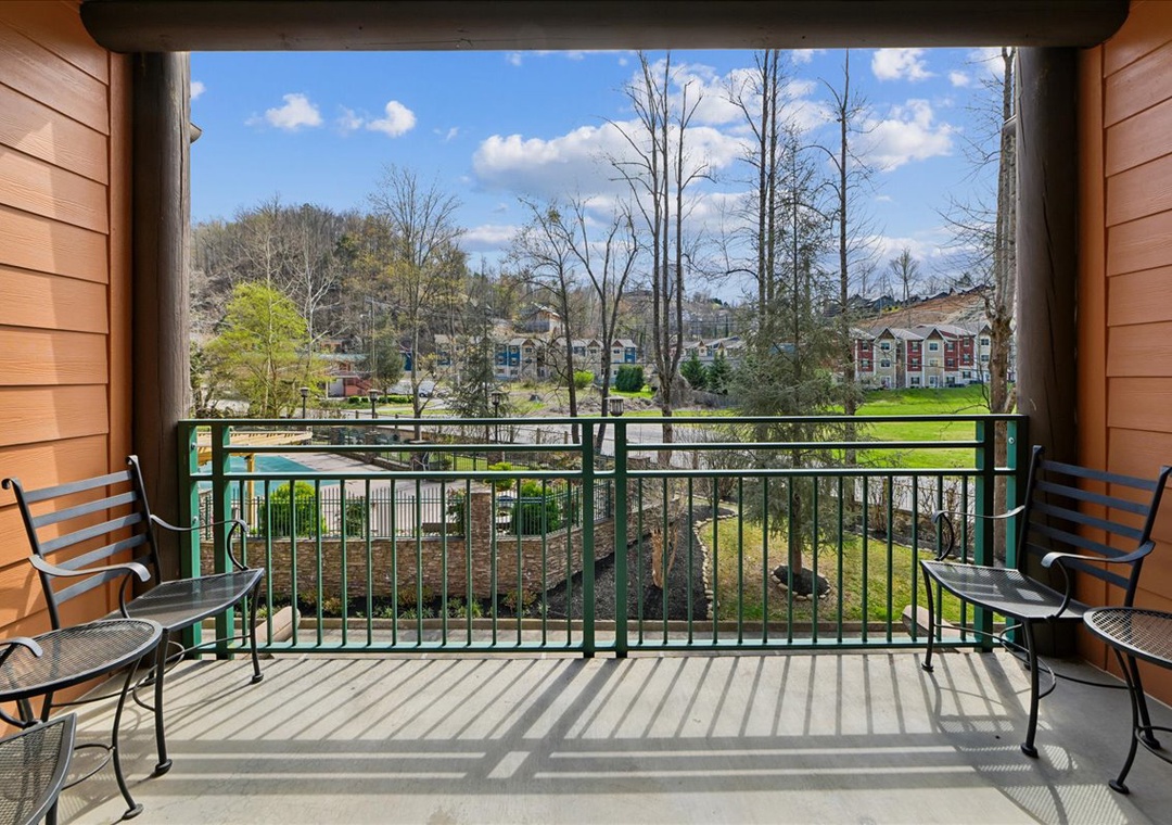 Step onto your private balcony and enjoy peaceful neighborhood views with comfortable seating for morning coffee or evening relaxation.