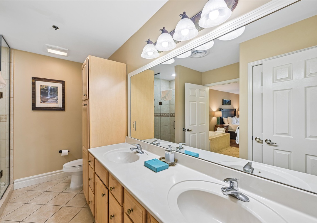 Your spacious master bathroom features dual sinks and ample storage, perfect for getting ready together each morning.