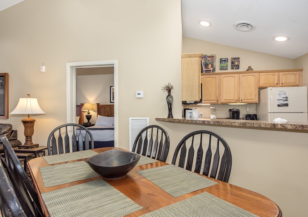Your open dining area flows seamlessly into the fully equipped kitchen, perfect for memorable meals together.