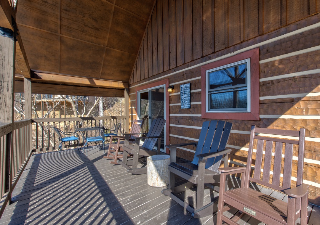 Relax on your private covered deck with rustic Adirondack chairs, perfect for morning coffee or evening unwinding.