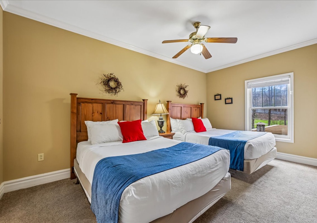 Settle into your comfortable twin bedroom with crisp linens, rustic wooden headboards, and peaceful garden views through your private window.