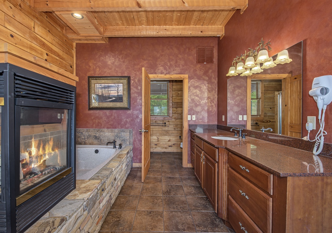 Unwind in your own spa-like sanctuary, where a stone-surround soaking tub and a cozy fireplace create the perfect retreat after a day of adventure.