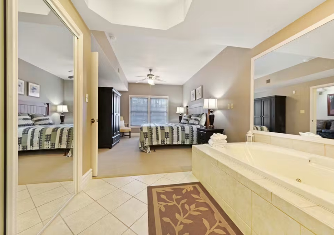Your spacious suite offers romantic luxury with a jetted tub overlooking your cozy bedroom retreat.