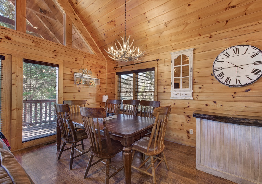 Gather around your rustic dining table where antler chandeliers cast warm light over memorable meals with loved ones.