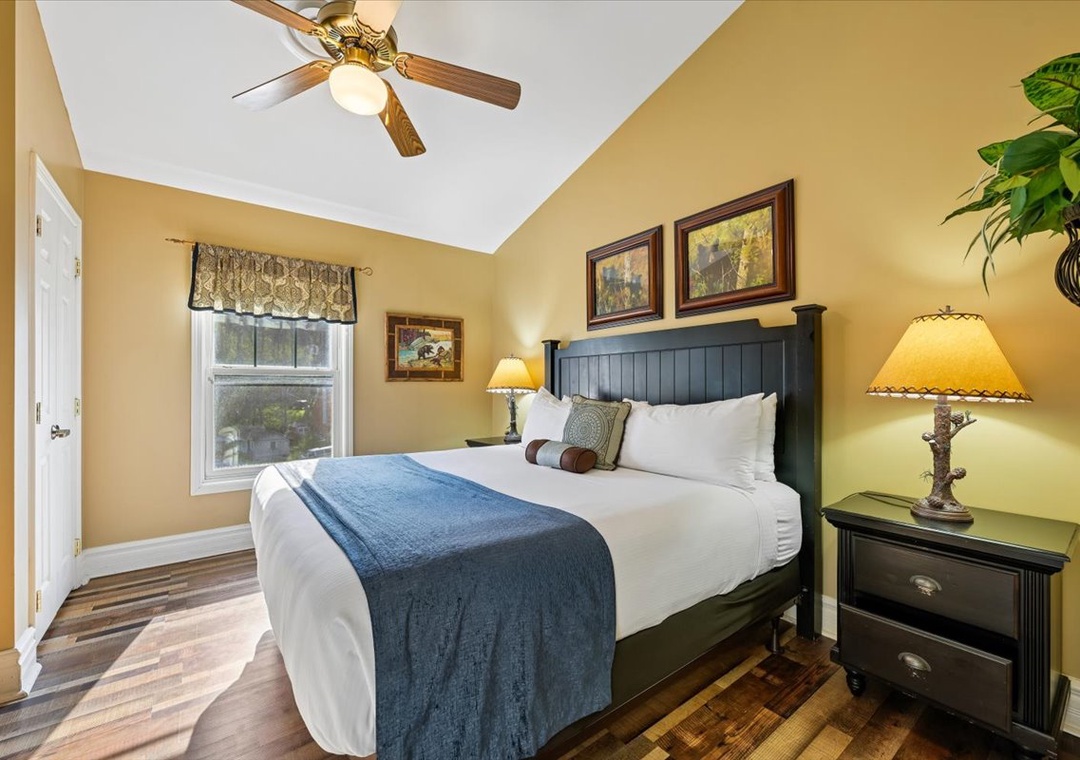 Sink into crisp linens and rustic charm in your cozy bedroom retreat, where warm lighting and thoughtful decor create the perfect sanctuary.