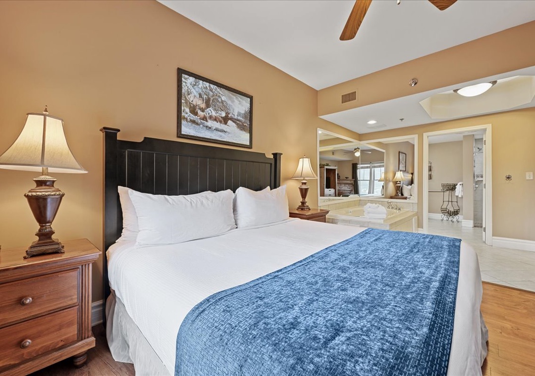 Sink into crisp white linens and let warm bedside lighting create your perfect retreat after exploring.