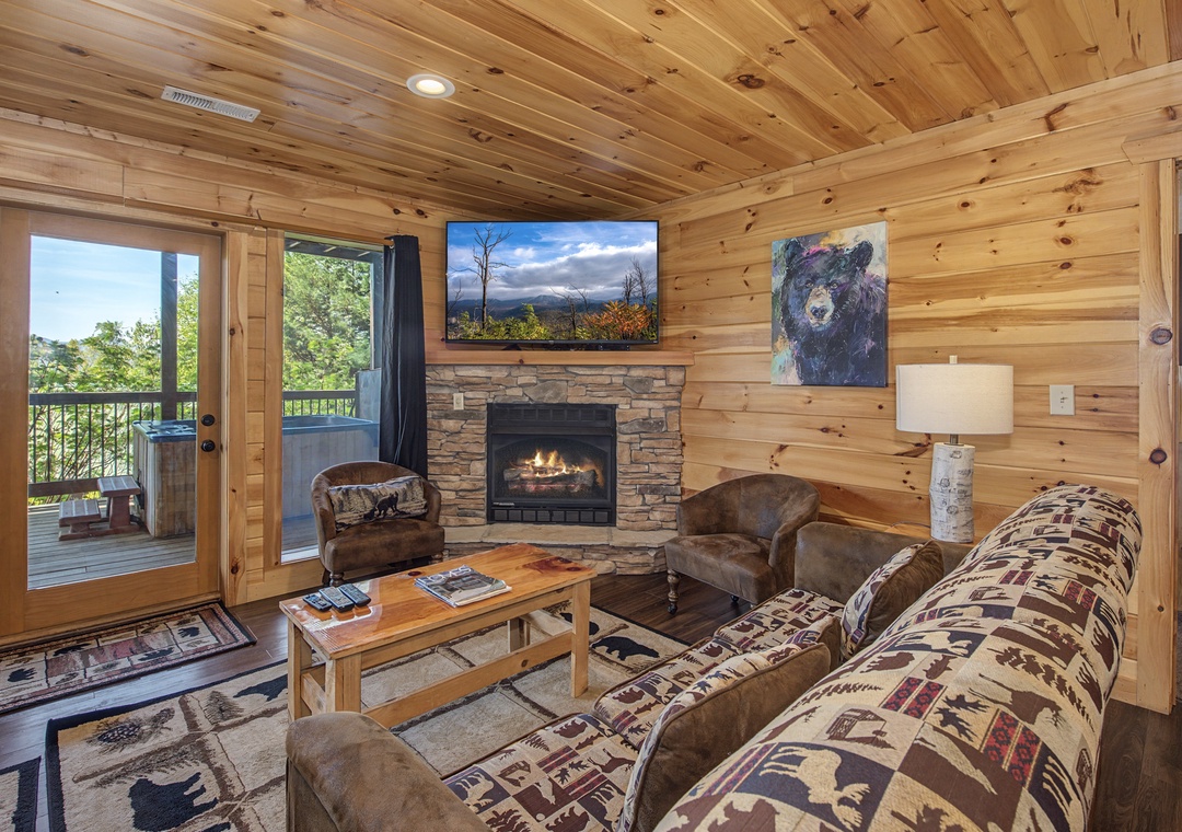 Cozy up in your rustic living room with crackling fireplace, comfy seating, and mountain views from your private deck.