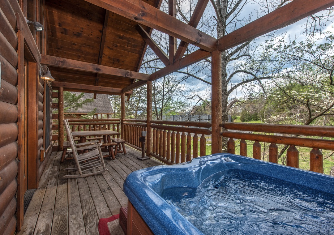 Soak in your private hot tub while swaying gently in the rocking chairs on this covered deck surrounded by nature.