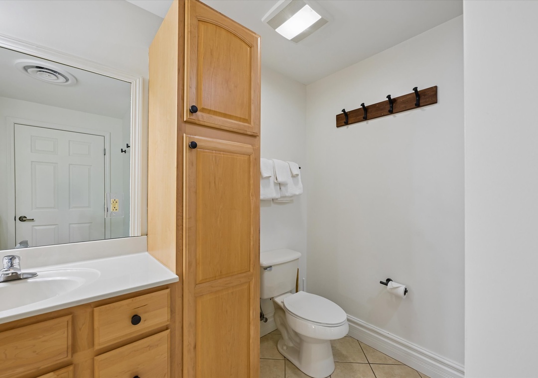 Your private bathroom features a spacious vanity with ample storage, plus convenient hooks for your towels and belongings.