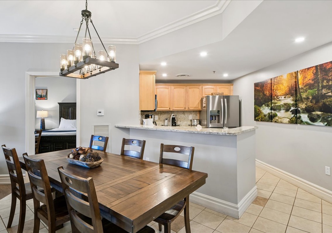 You'll love gathering around this warm dining table while your chef prepares meals in the open kitchen nearby.