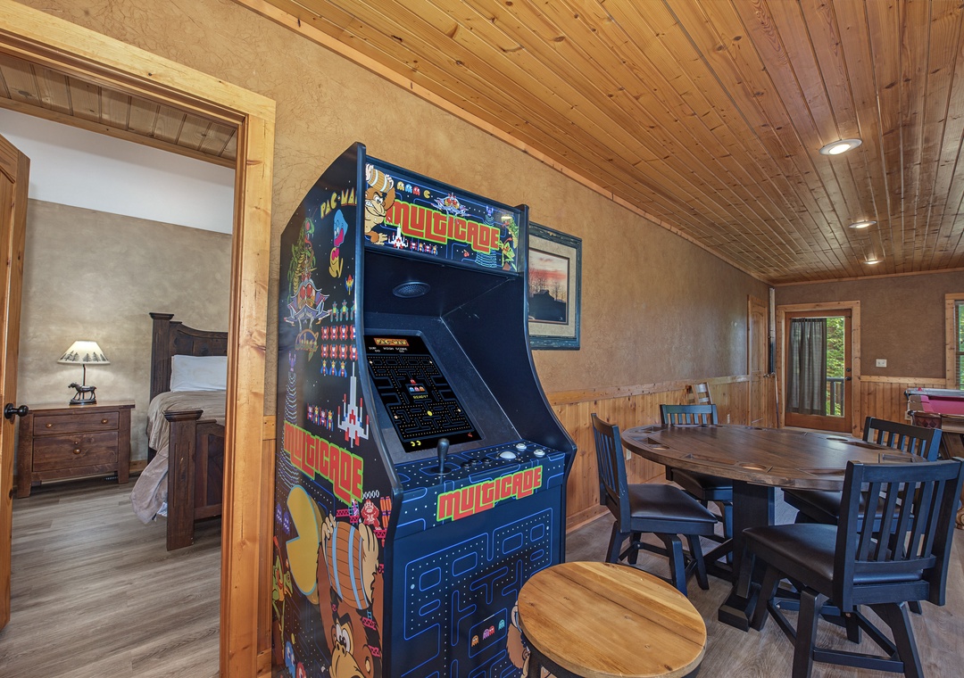 Challenge your travel companions to a friendly arcade competition in this warm, wood-paneled game area, where you'll find classic entertainment beside your dining space.