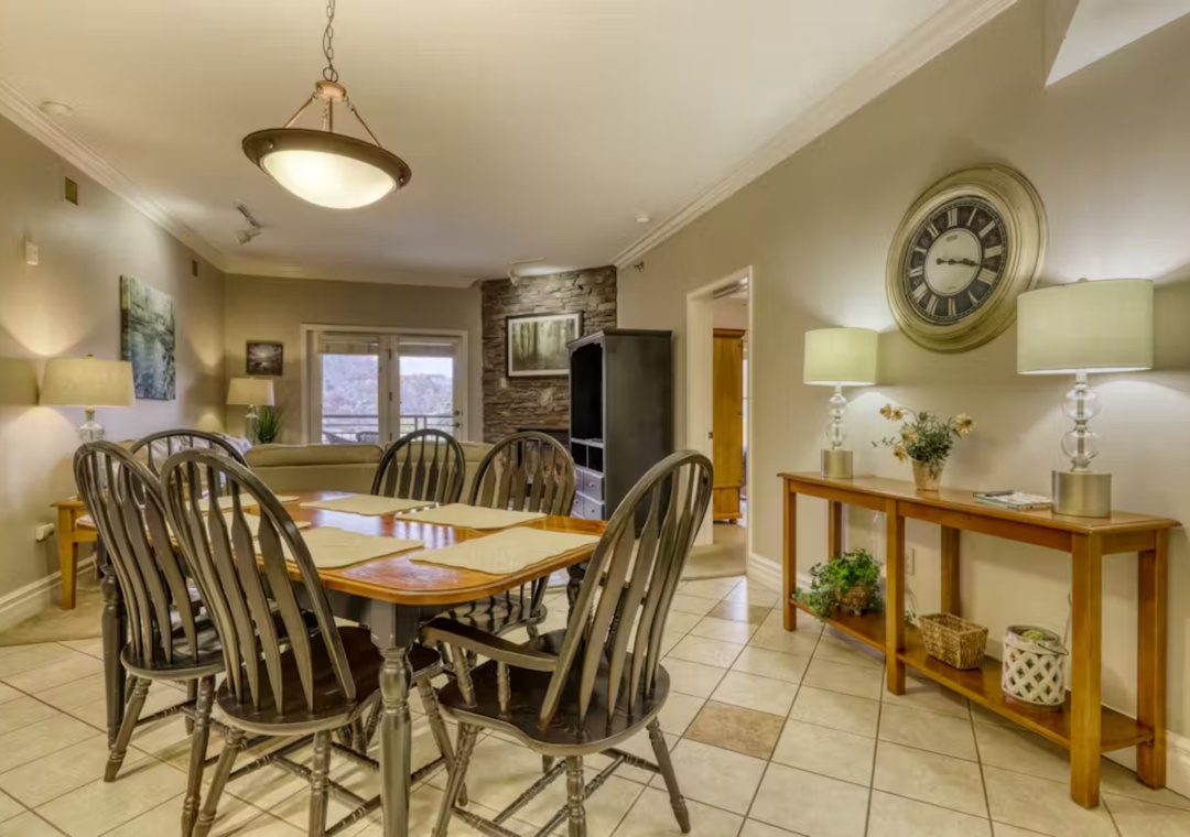 Gather around your spacious dining table for memorable meals with loved ones in this warm, inviting space.