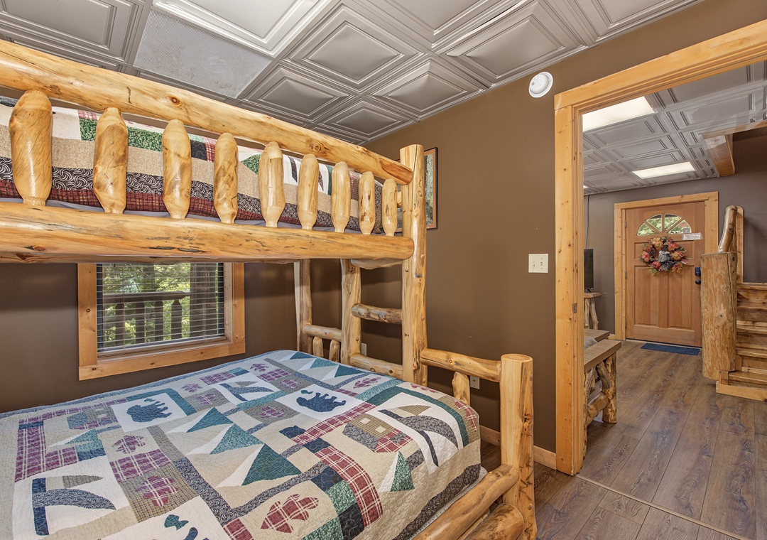 Charming rustic bunk beds with handcrafted log frames bring cozy cabin vibes to your mountain getaway, perfect for family bonding and restful nights.