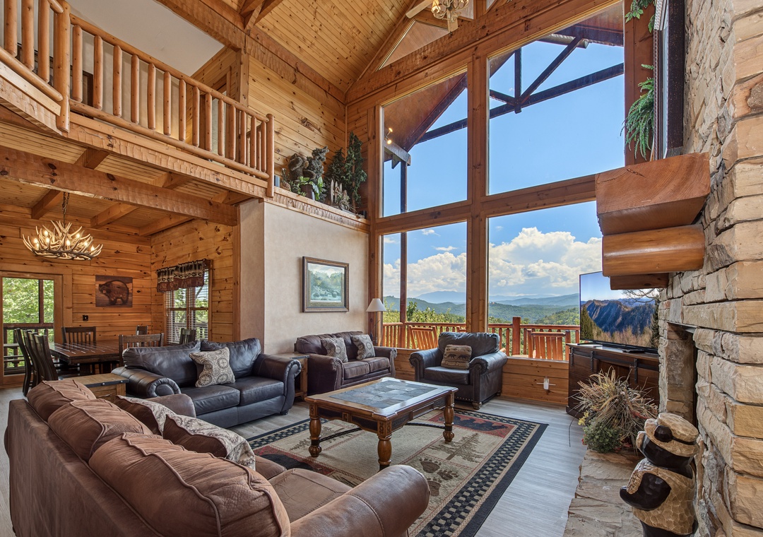 Sink into plush leather sofas and let your gaze wander through soaring windows framing breathtaking mountain peaks. Vaulted ceilings and rustic timber create a cozy sanctuary where every sunset feels like your own private masterpiece.
