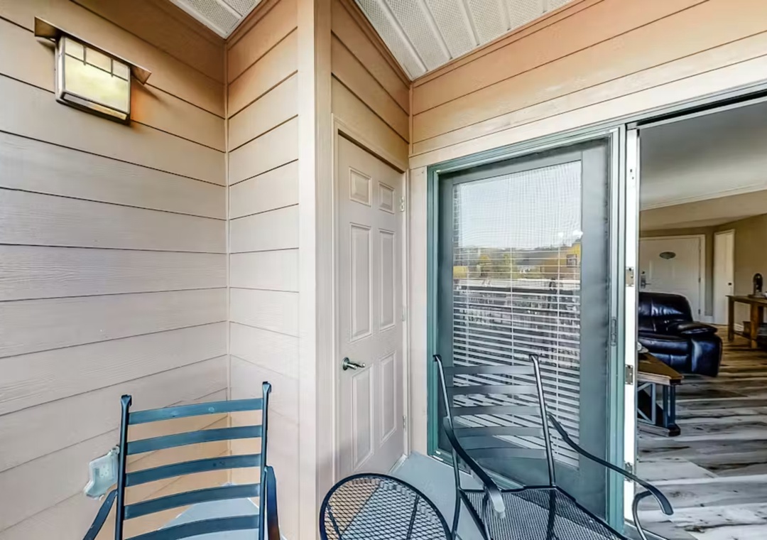 Step onto your private balcony where morning coffee tastes better in the fresh air, overlooking peaceful views beyond.