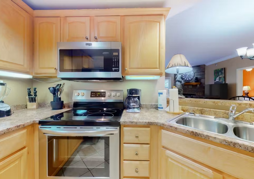 Cook your favorite meals in this fully equipped kitchen with granite countertops, stainless steel appliances, and everything you need for a comfortable stay.