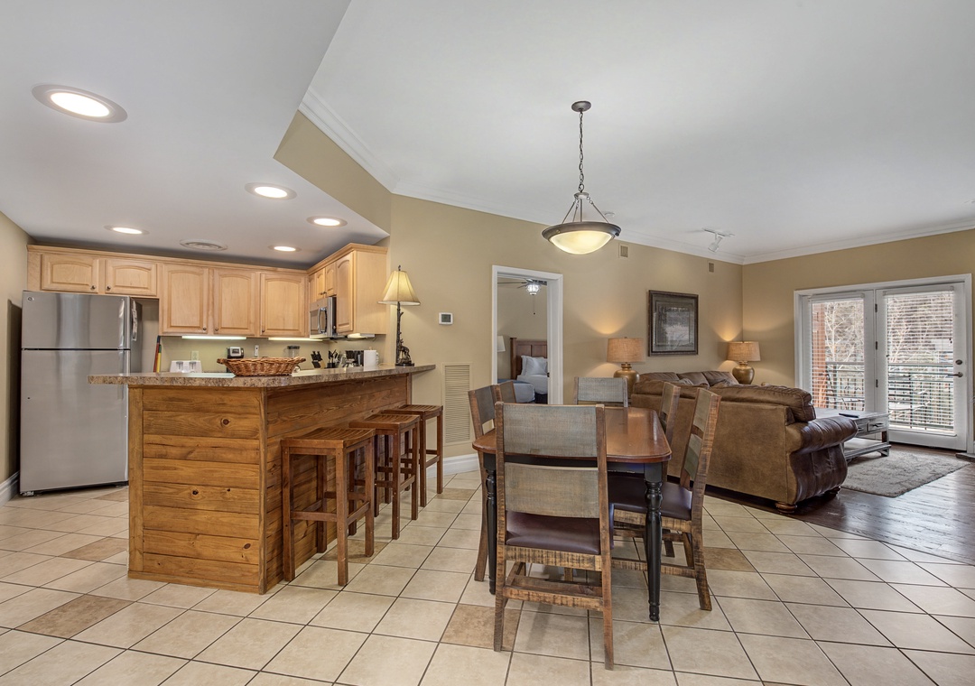 Relax in your open-concept space where warm wood tones and modern amenities create the perfect home-away-from-home atmosphere.