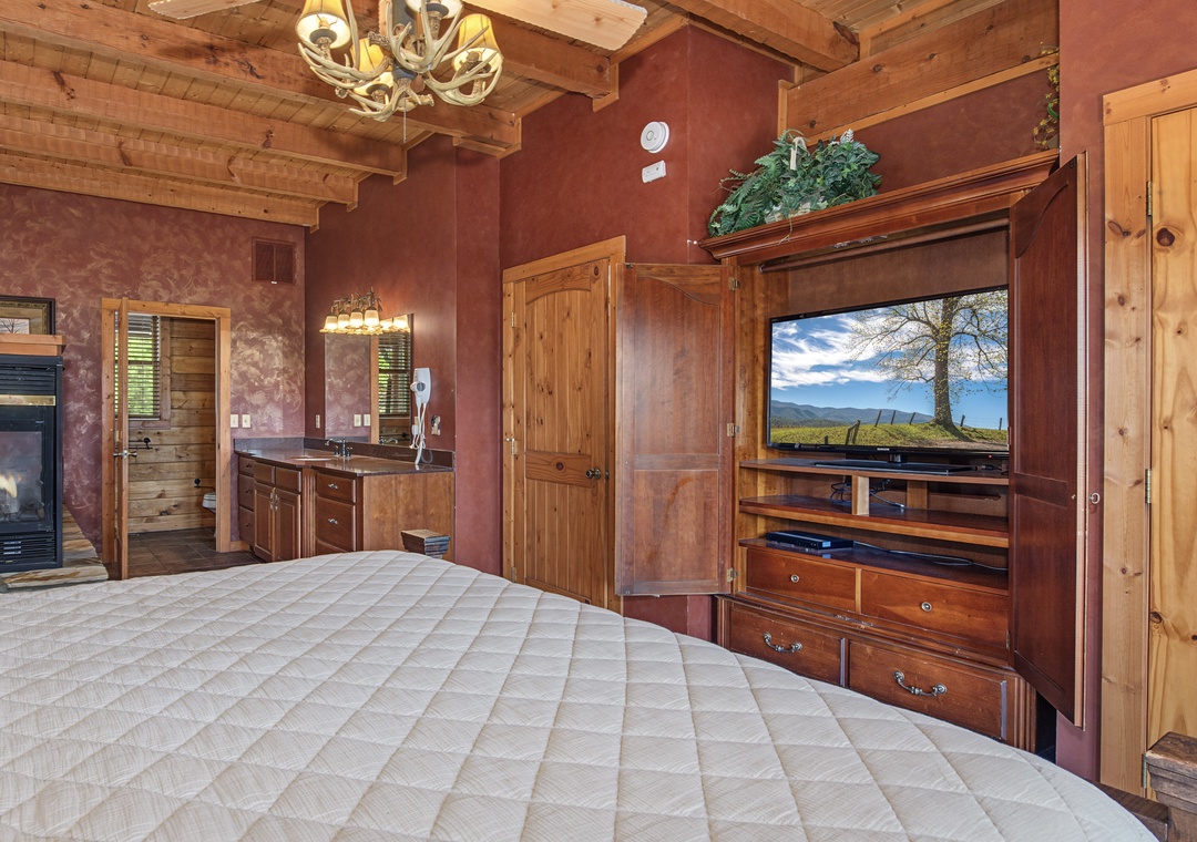 Unwind in your cozy retreat with stunning exposed beam ceilings, a warm fireplace, and modern entertainment at your fingertips—everything you need for total relaxation.