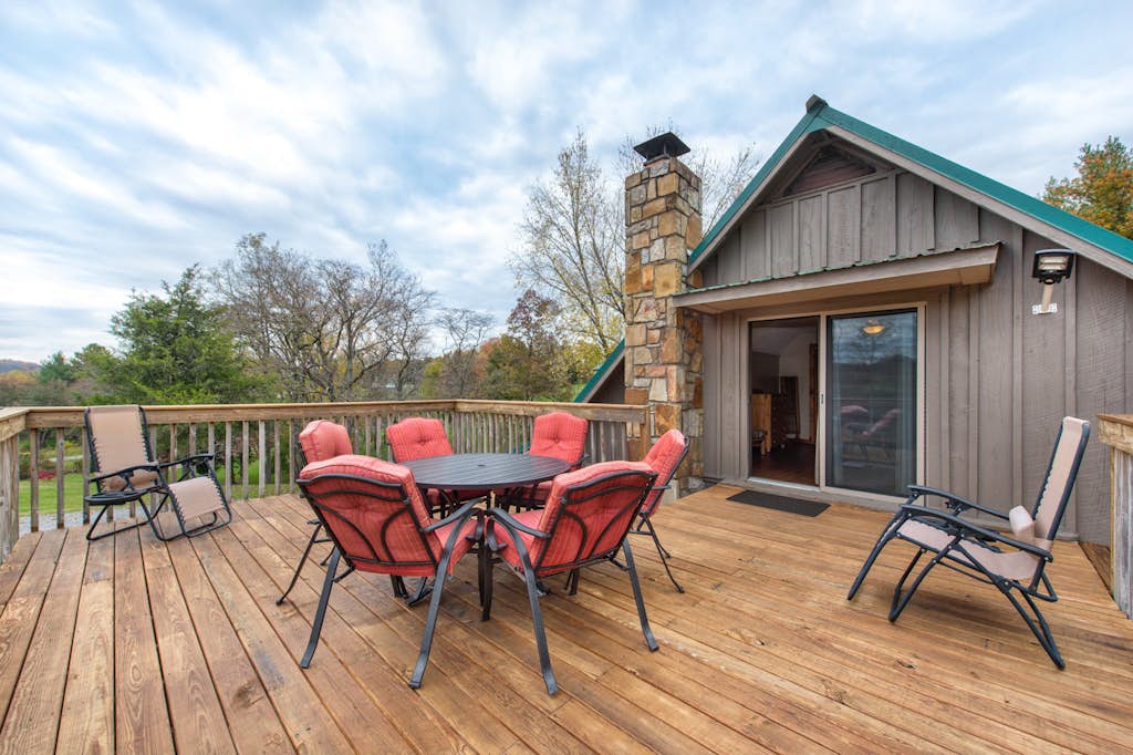 Picture yourself unwinding on this spacious deck with mountain views, gathering around the table for meals, or simply soaking in the peaceful surroundings from your private outdoor retreat.