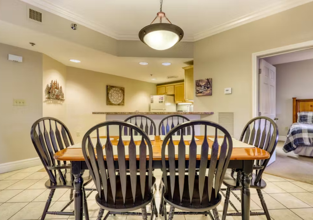 Gather around your spacious dining table for memorable meals together in this warm, inviting space.