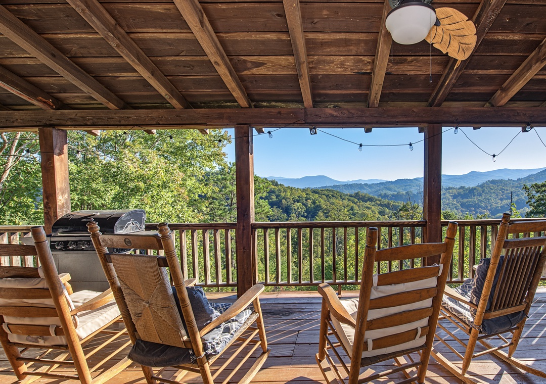 Settle into your rocking chair on this covered deck and let the mountain views take your breath away. With a BBQ grill at hand and the serenity of nature all around, this is your perfect spot to unwind.