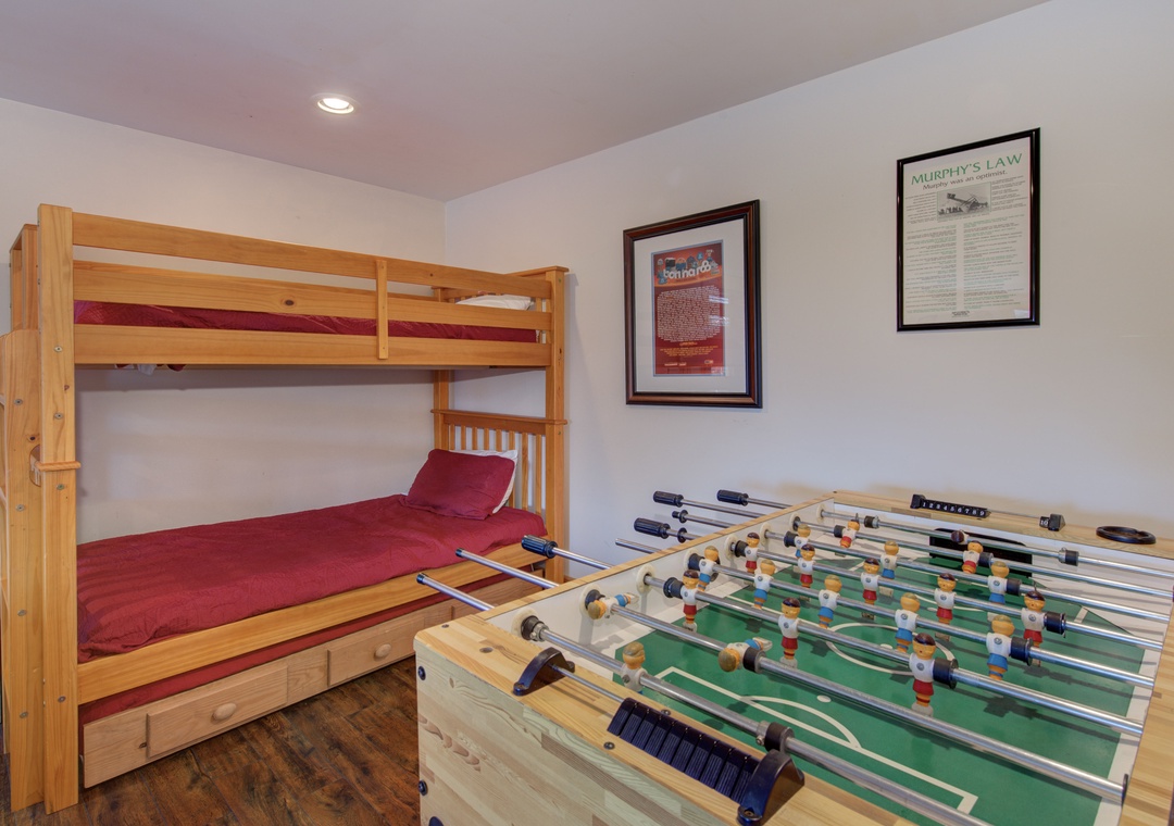 Your kids will love the cozy bunk beds and endless foosball tournaments in this playful room designed for fun and laughter.