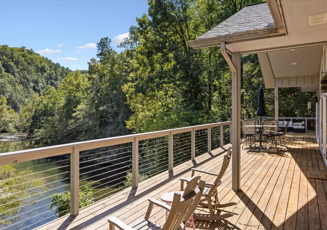Relax on your private deck with stunning river views, where morning coffee and evening sunsets become unforgettable moments.