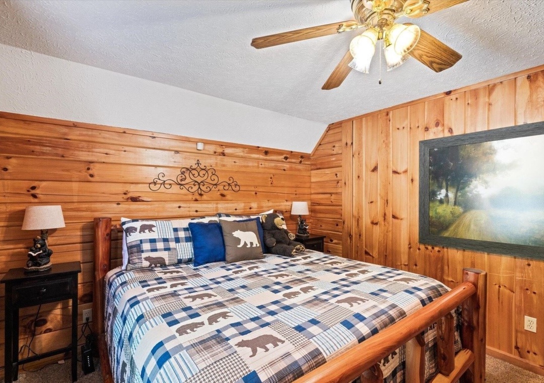 Cozy up in your rustic bedroom with warm wood walls, plaid bedding, and peaceful cabin charm for restful nights.