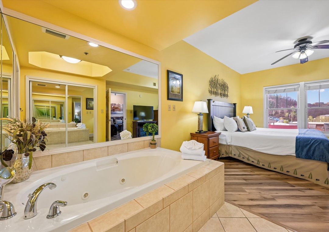 Unwind in your spacious suite with a luxurious jetted tub, cozy fireplace, and stunning city views through expansive windows.