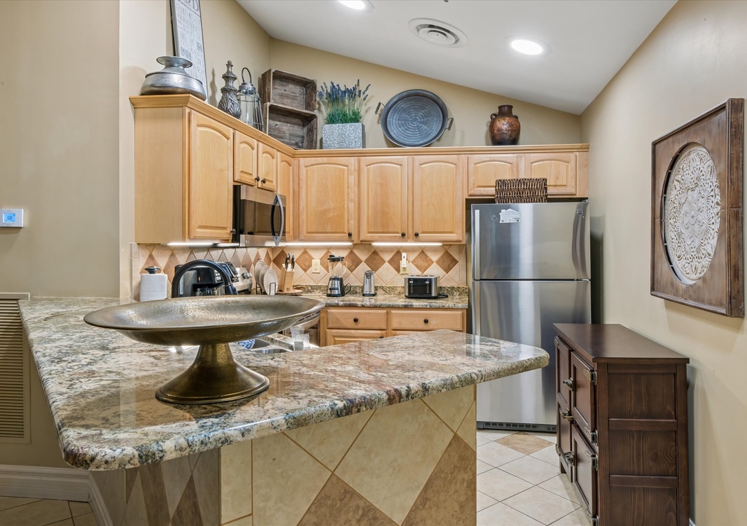 Your fully equipped kitchen invites culinary adventures with granite counters, stainless appliances, and charming southwestern touches throughout.