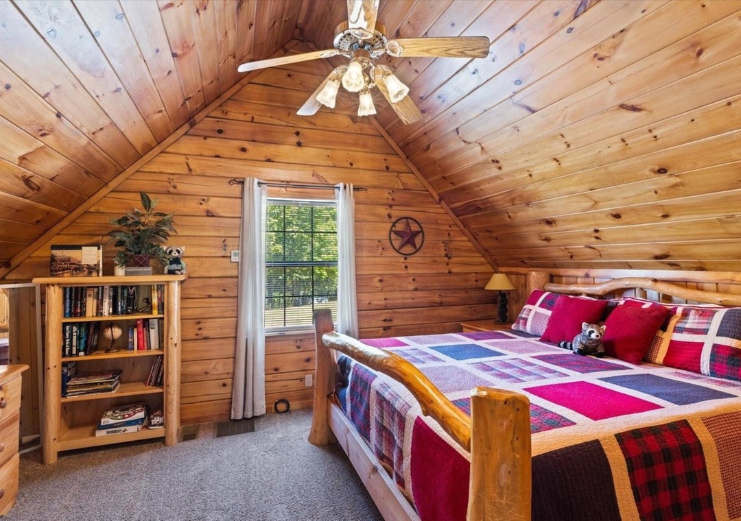 Cozy up in your rustic log bedroom with warm wood walls, soft quilted bedding, and charming cabin details.