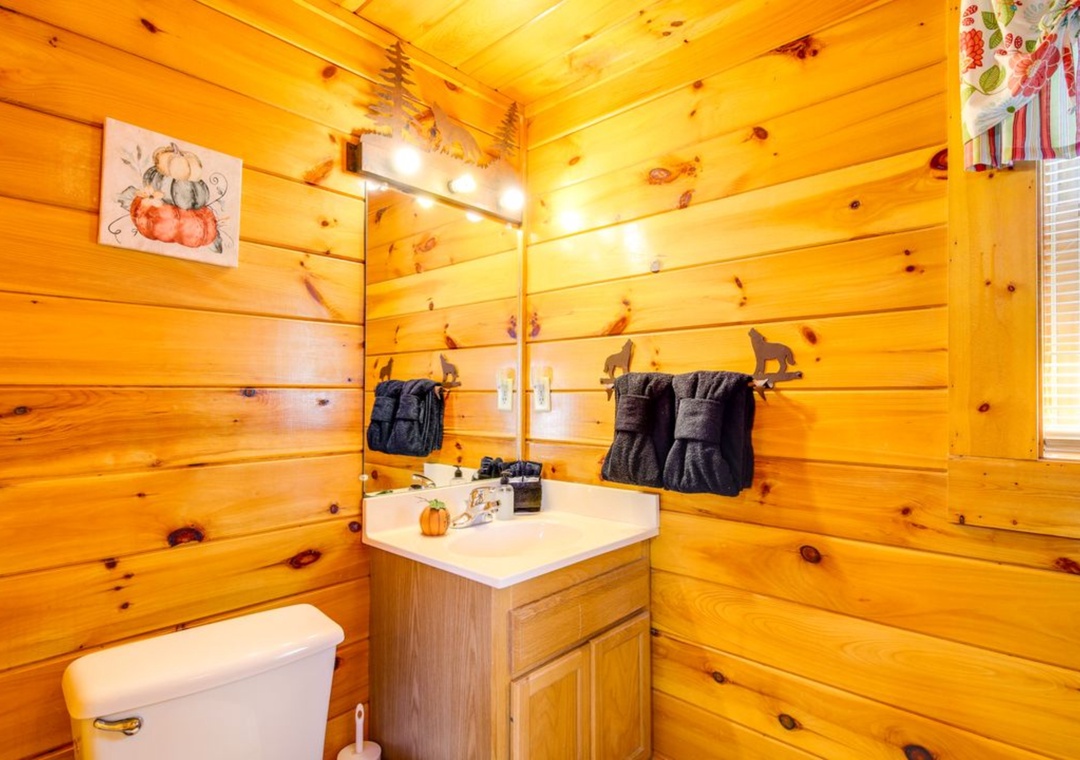 Warm up in your cozy log cabin bathroom, where rustic charm meets comfort with soft towels and thoughtful touches.