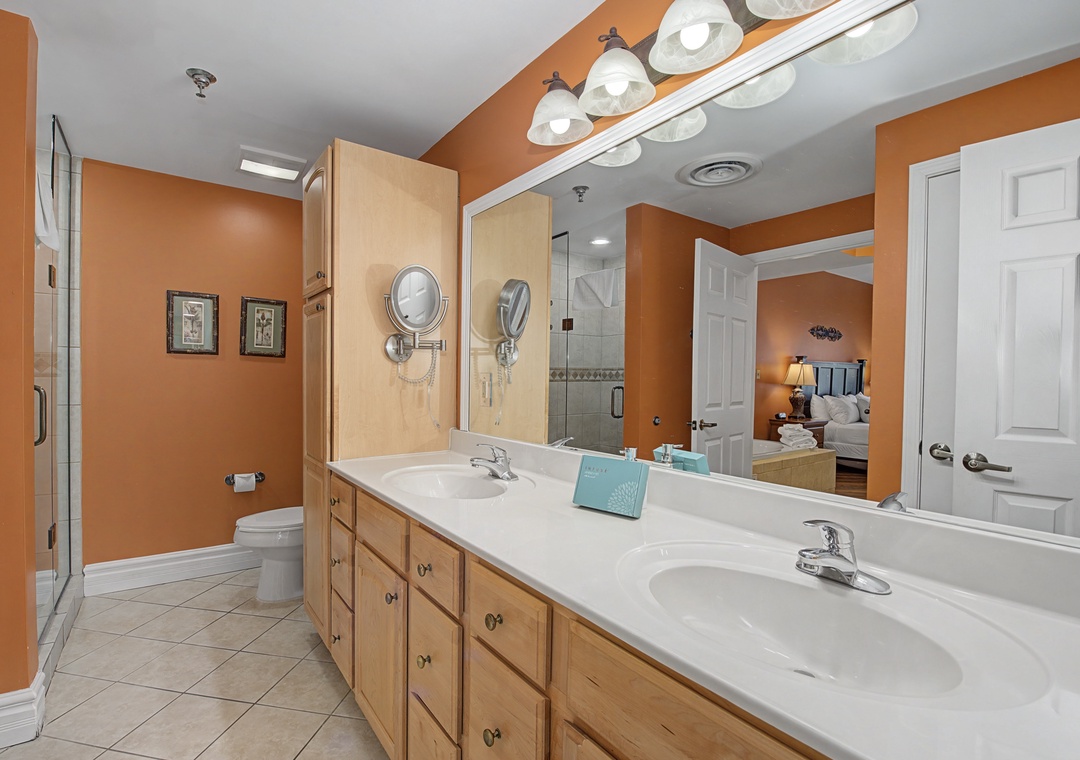 Your spacious master bathroom features dual sinks, warm lighting, and a glass shower for a luxurious start to each day.