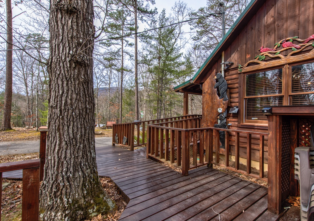 Step onto your private wooden deck surrounded by towering trees, where nature's tranquility meets rustic charm in perfect harmony.