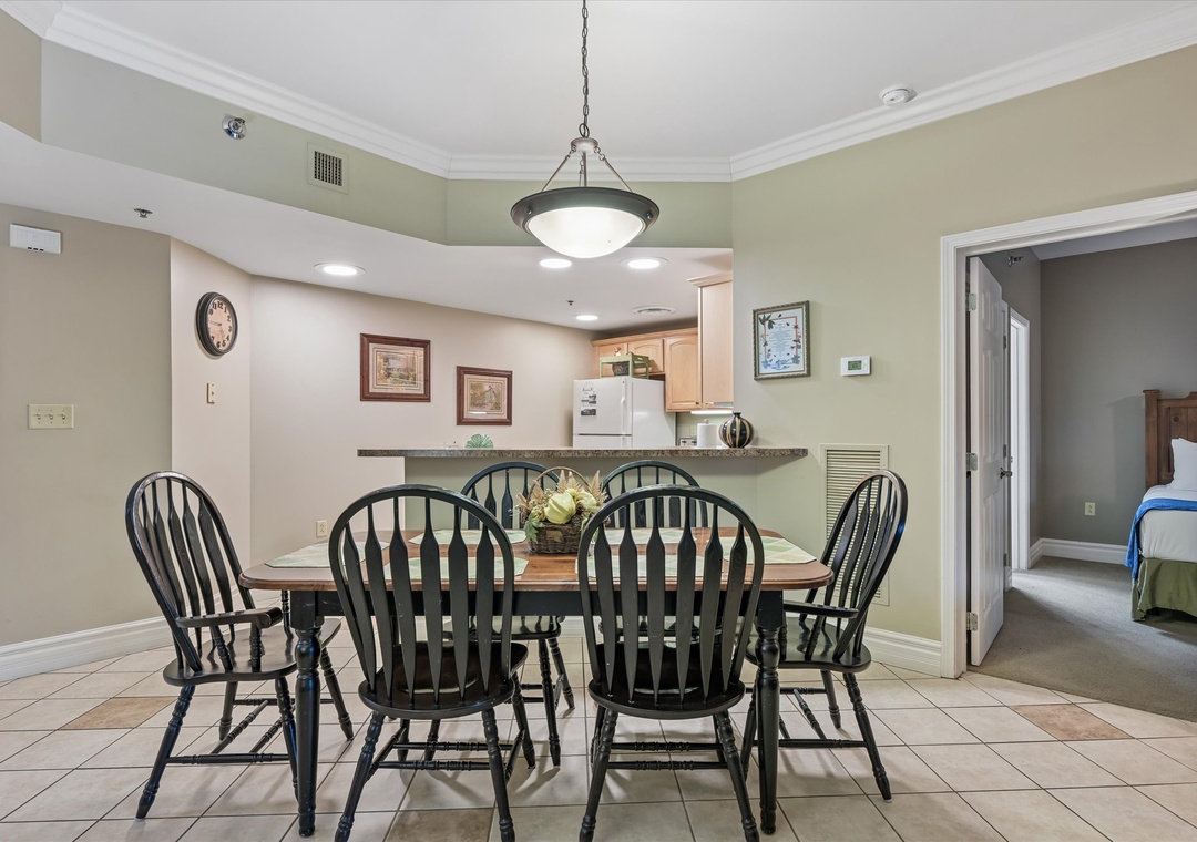 Gather around your spacious dining table for memorable meals with family and friends in this welcoming open-concept space.