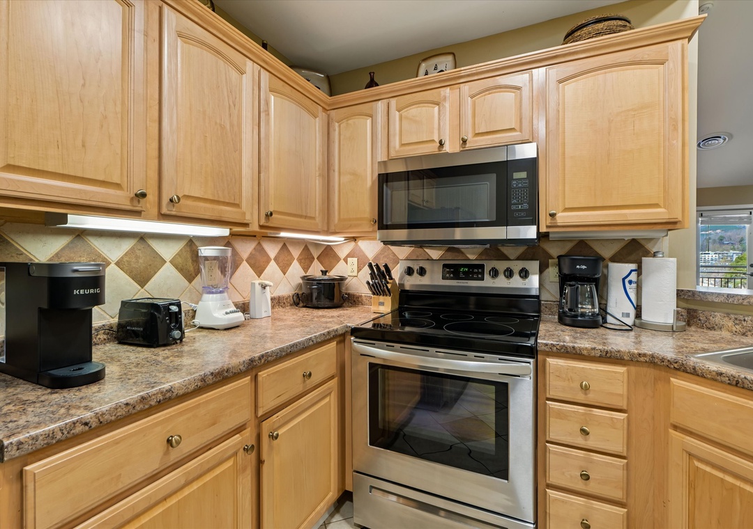 Your fully-equipped kitchen awaits with granite counters, stainless appliances, and everything needed to prepare memorable meals during your stay.