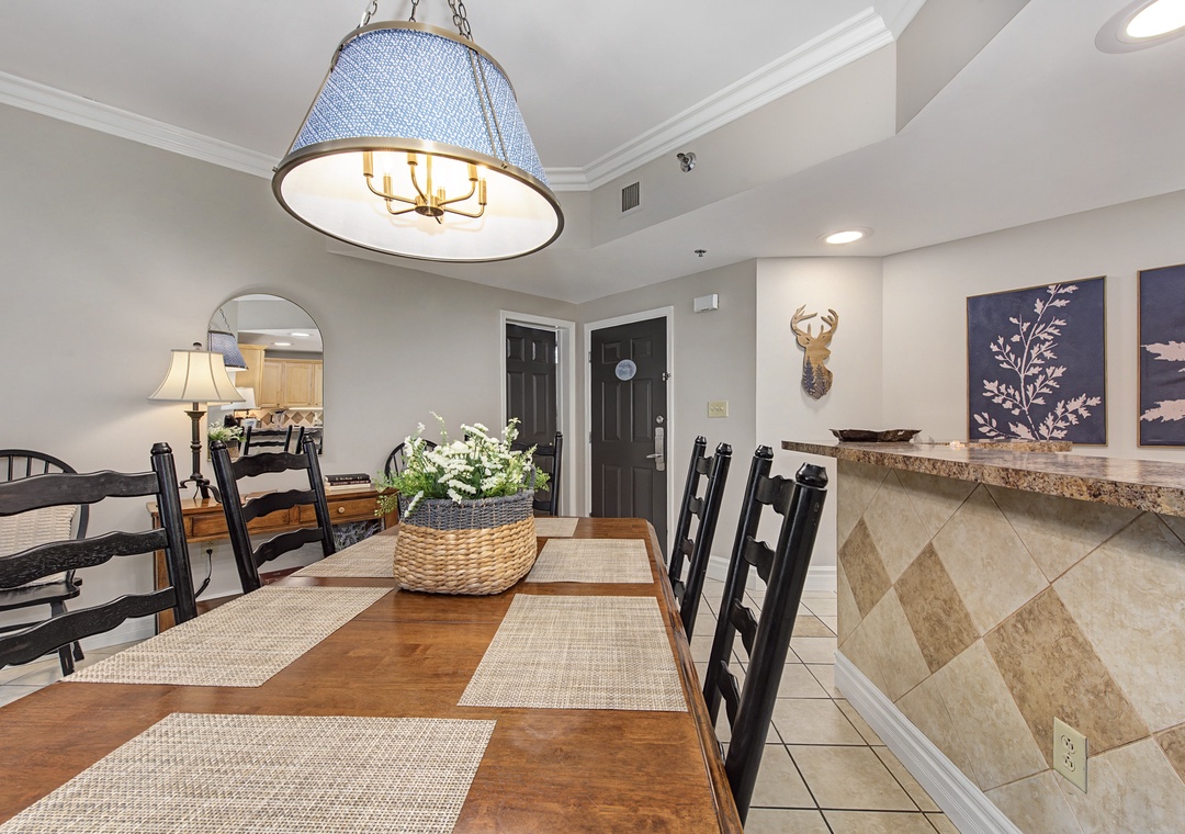 Gather around your spacious dining table under elegant chandelier lighting, where memorable meals and conversations unfold in this beautifully appointed space.