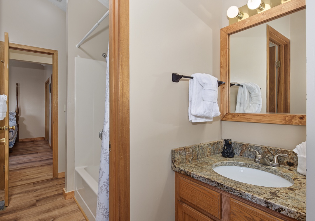 Freshen up in your well-appointed bathroom with granite countertops, plush towels, and thoughtful amenities—everything you need for a comfortable stay.