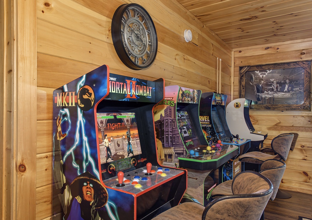 Your game room awaits with classic arcade machines and cozy seating for endless entertainment in this charming rustic retreat.