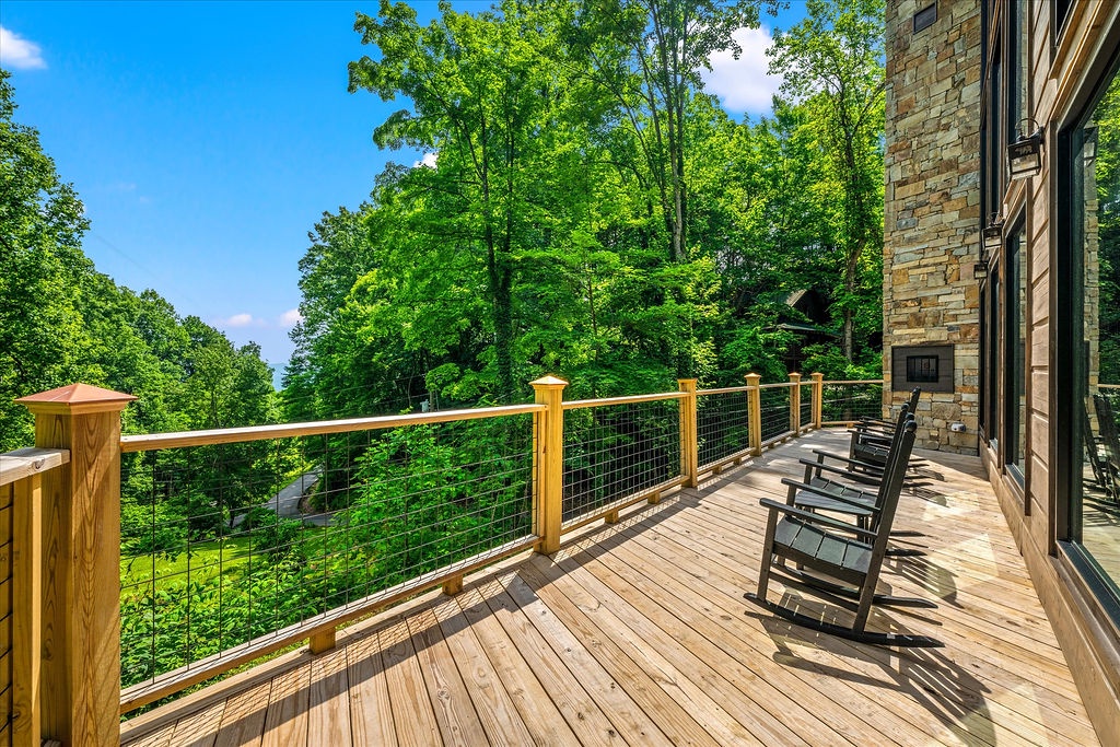 Step onto your private deck and breathe in the forest air as sunlight filters through towering trees. Rock in comfort while nature unfolds around you—a peaceful retreat where mornings and evenings become your favorite rituals.