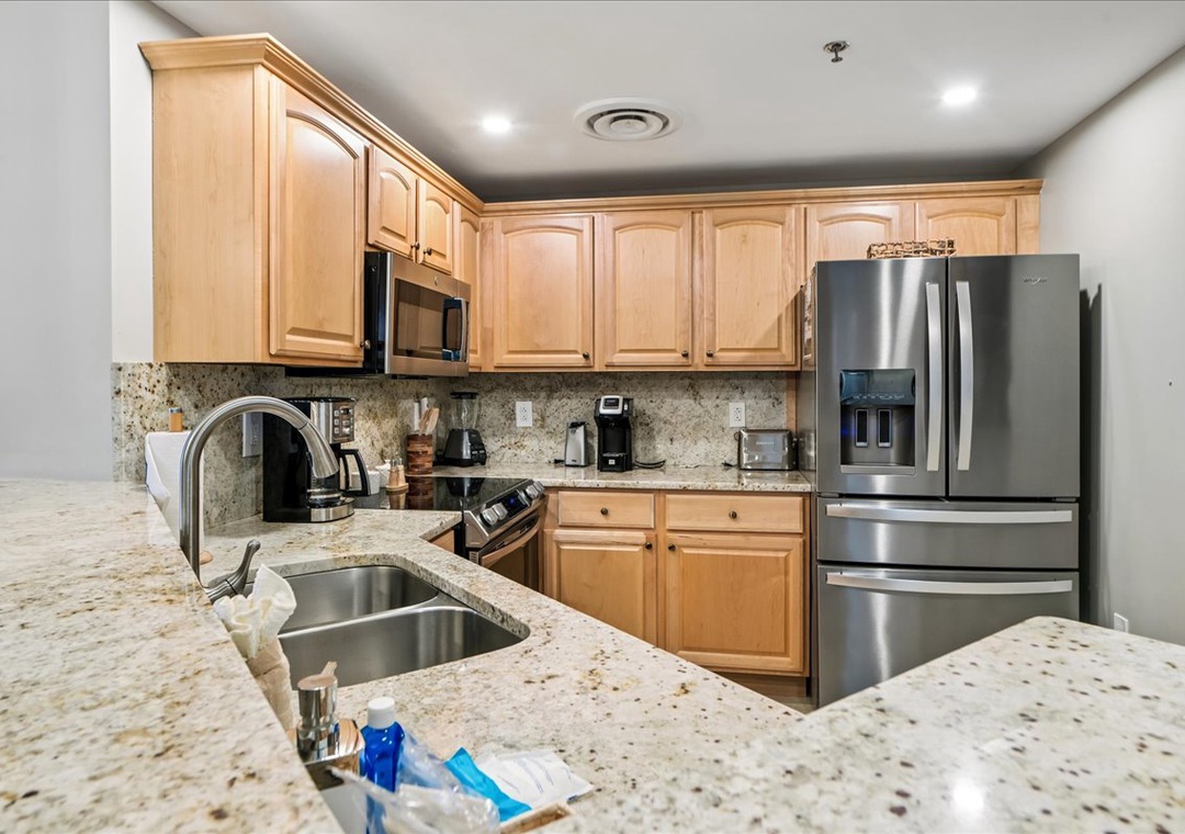 Your fully equipped kitchen awaits with granite counters, stainless appliances, and everything you need to create memorable meals during your stay.