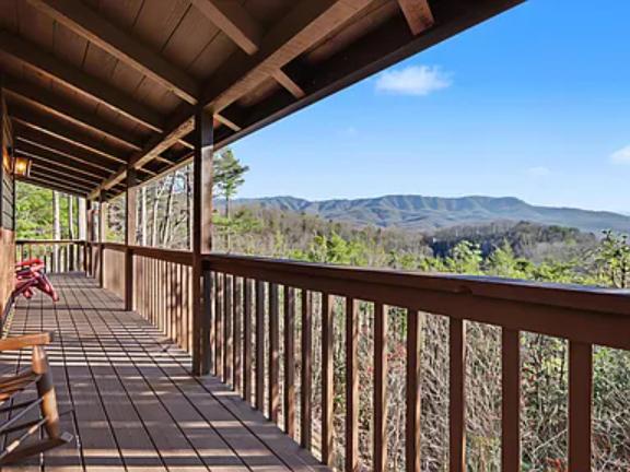 Sip your morning coffee on this spacious covered deck while taking in sweeping mountain vistas stretching across lush forest valleys.