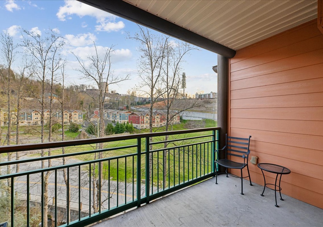 Step onto your private balcony and soak in sweeping views of the charming neighborhood below, perfect for morning coffee or evening relaxation.