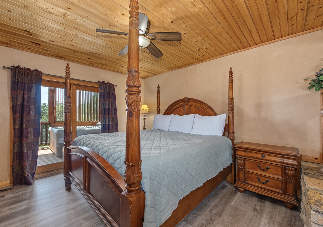Sink into a stately four-poster bed under beautiful wood-paneled ceilings, with direct balcony access bringing in natural light and fresh mountain air.