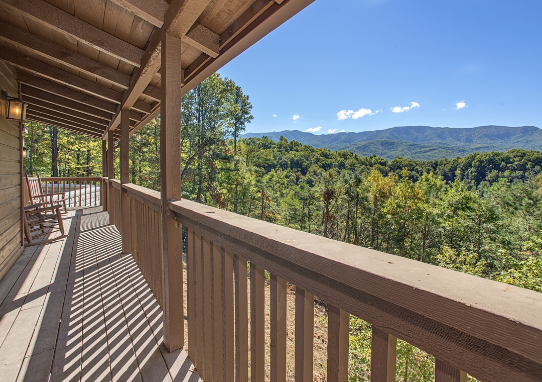 Step onto your private covered deck and breathe in the fresh mountain air. Stunning peaks stretch across the horizon, framed by lush forest—perfect for morning coffee or evening relaxation.