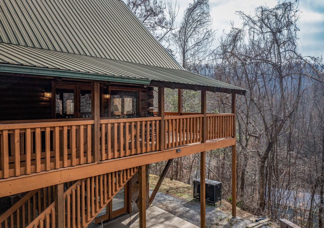 Step onto your private covered deck and breathe in the fresh mountain air while enjoying peaceful forest views.